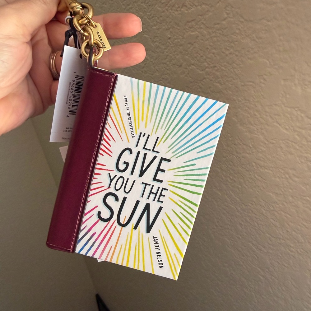 Coach book charm